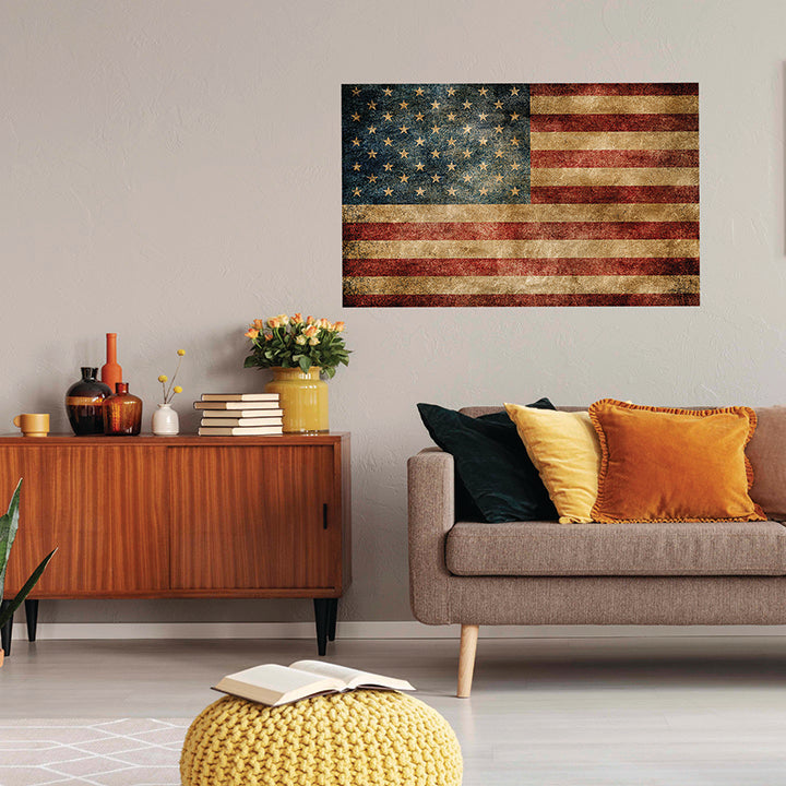 Living room with a vintage American flag painting, wooden sideboard, and gray sofa.