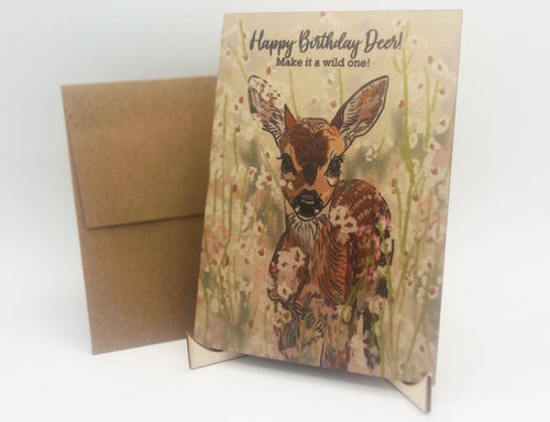 Birthday card with deer illustration and brown envelope on a white background